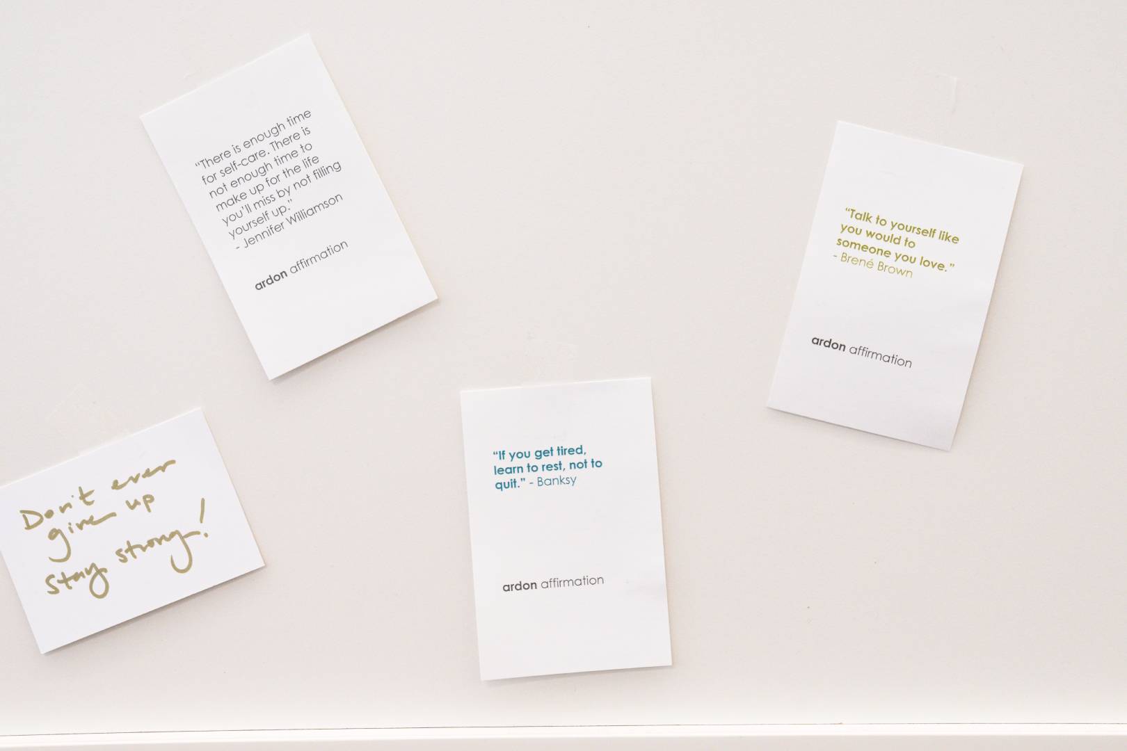 Four wall cards with motivational quotes, including “Don’t know, give up, stay strong Four wall cards with motivational quotes, including “Don’t know, give up, stay strong